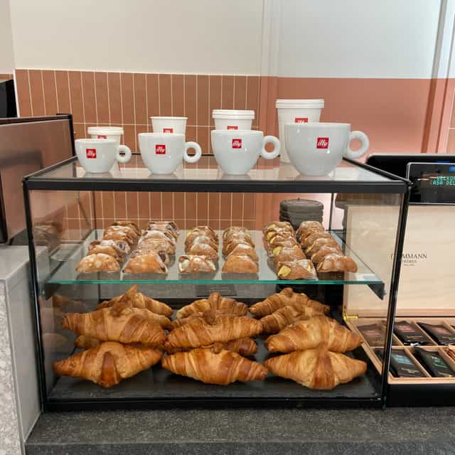 Image of pastries and coffee mugs