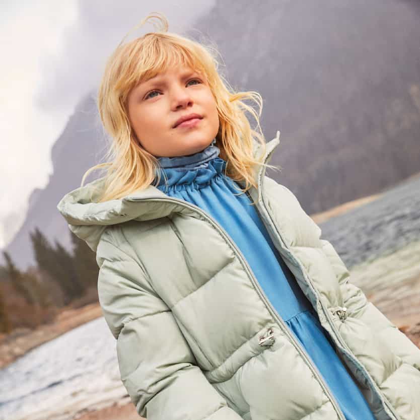 Il Gufo girl model with grreen jacket and light blue dress