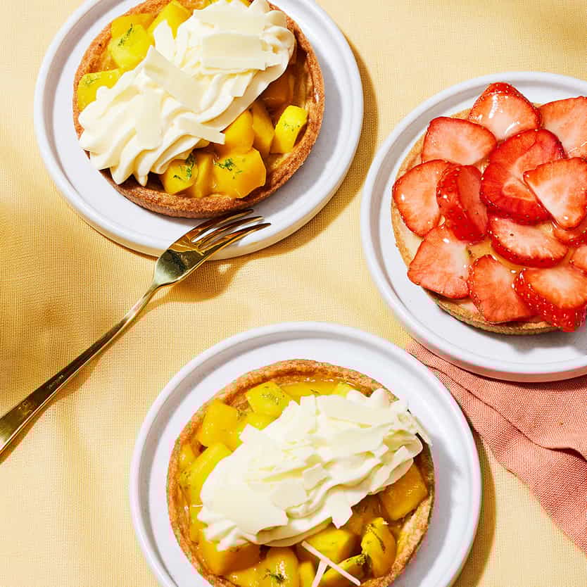 Some delicous tarts with apples and strawberries