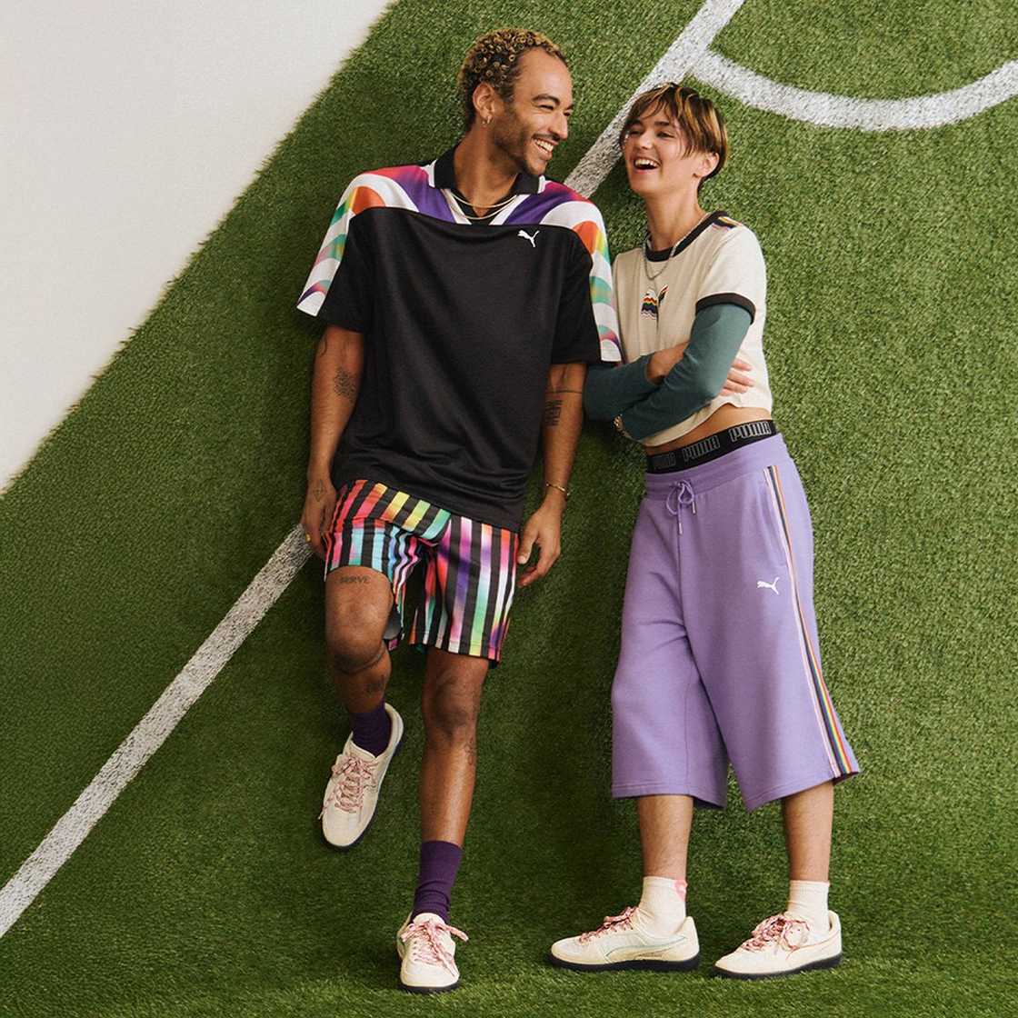 Two people lying down on the grass.