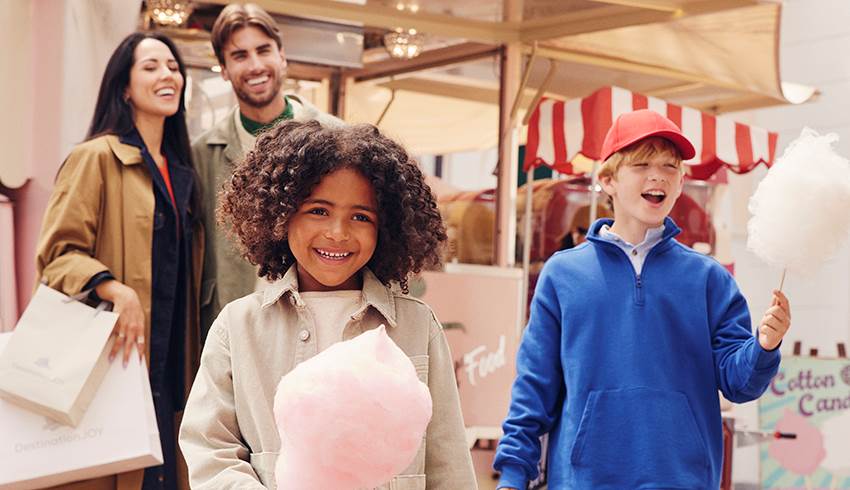 An image of a family shopping at an outlet